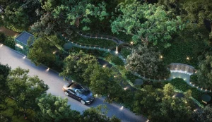 Aerial view of the lush Urban Oasis landscaped garden, water features, and private tree-lined driveway at Noble Form Thonglor luxury condo Sukhumvit 55 Bangkok