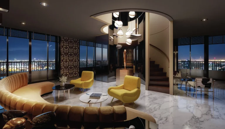 Noble Form Thonglor luxury condo 37th-floor resident lounge and library with plush seating and nighttime city views on Sukhumvit 55 Bangkok